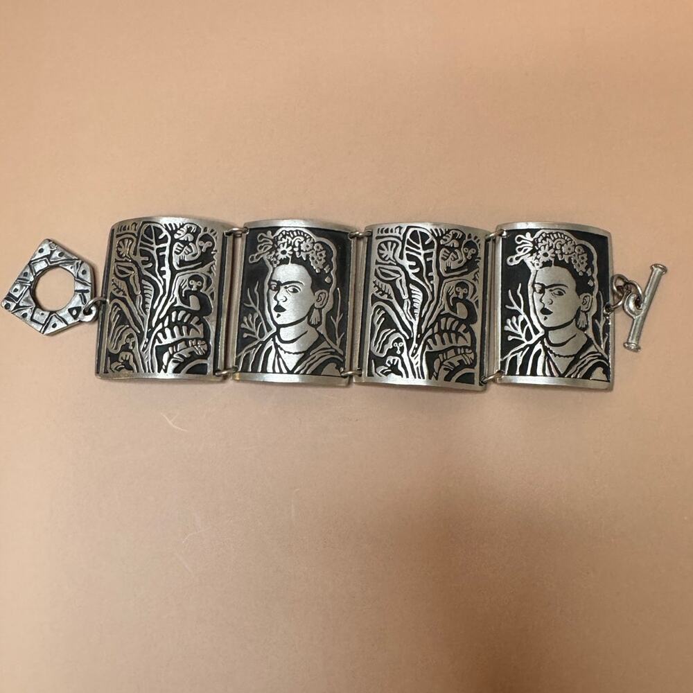 Vintage artisan Alice Seely Frida Kahlo inspired linked carved cuff bracelet.